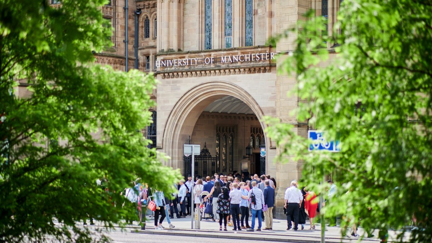 People gathered beneath the arch at Whitworth Hall.